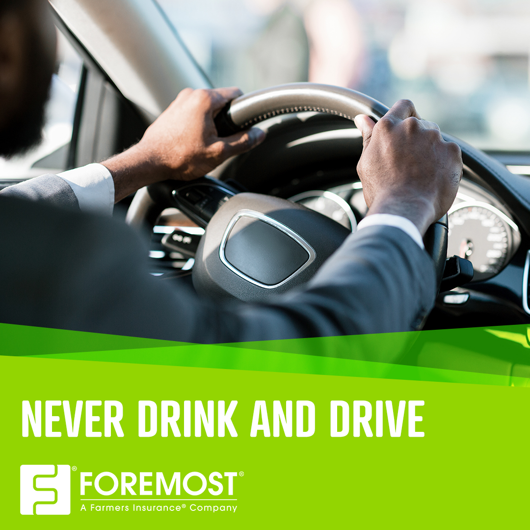 Person with two hands on the wheel driving